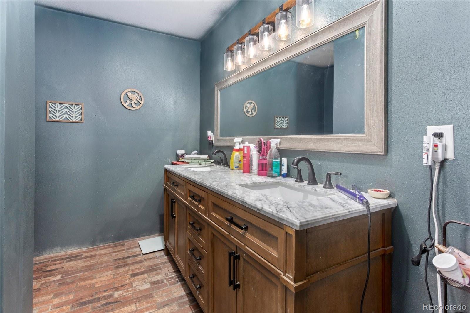 51624 Co Road Villa Grove, CO 81155 - Photo 16 of 50 a bathroom with a sink and a mirror