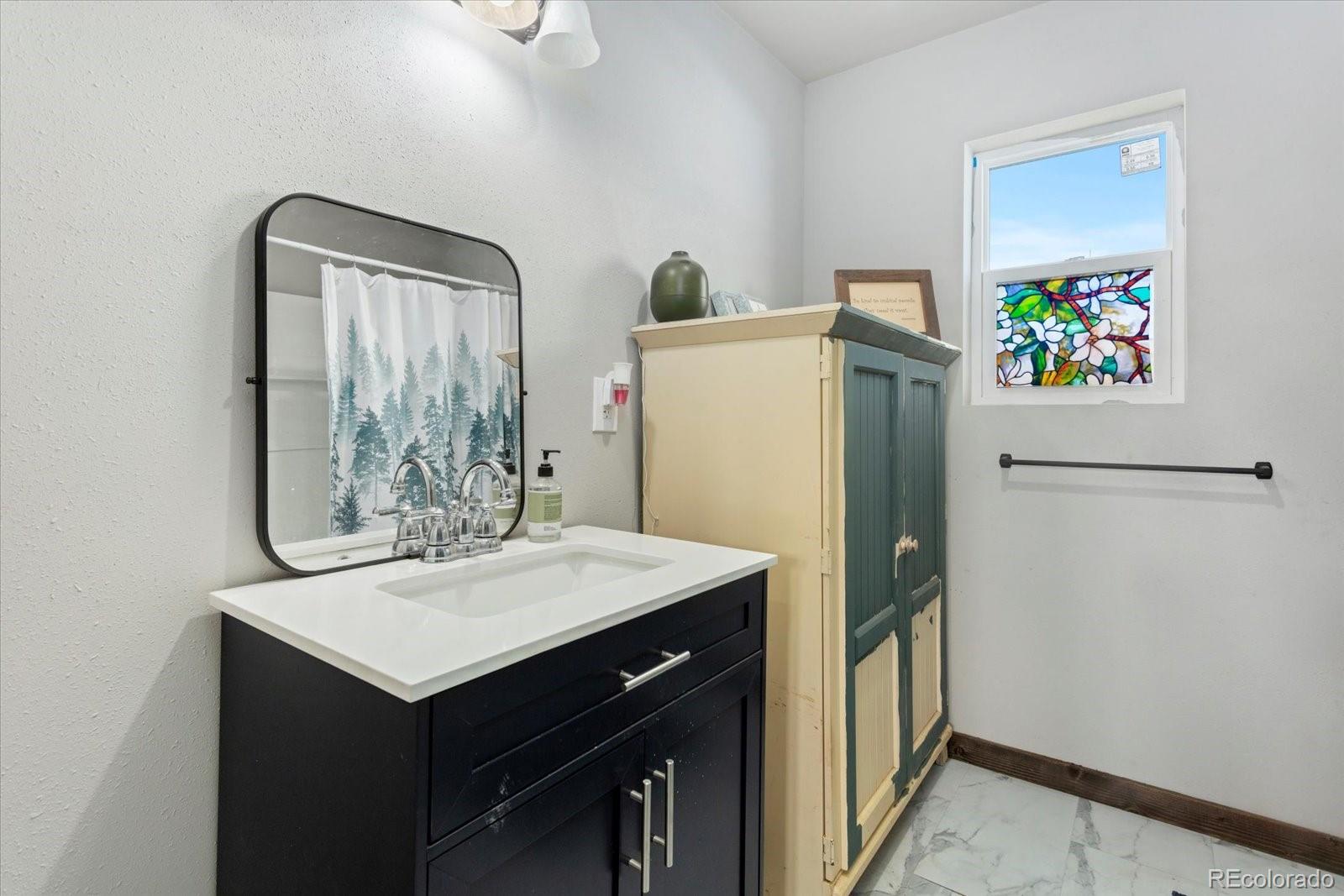 51624 Co Road Villa Grove, CO 81155 - Photo 20 of 50 a kitchen with a refrigerator and a sink