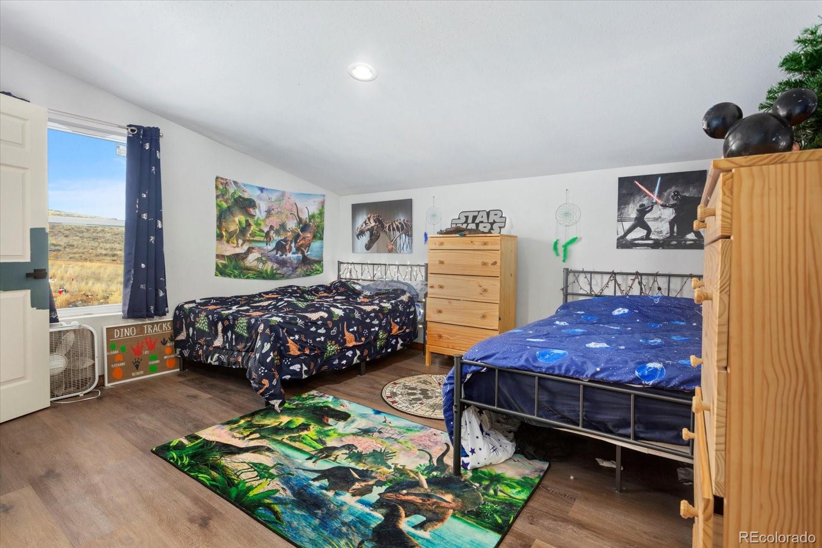 51624 Co Road Villa Grove, CO 81155 - Photo 26 of 50 a bed room with furniture and a window