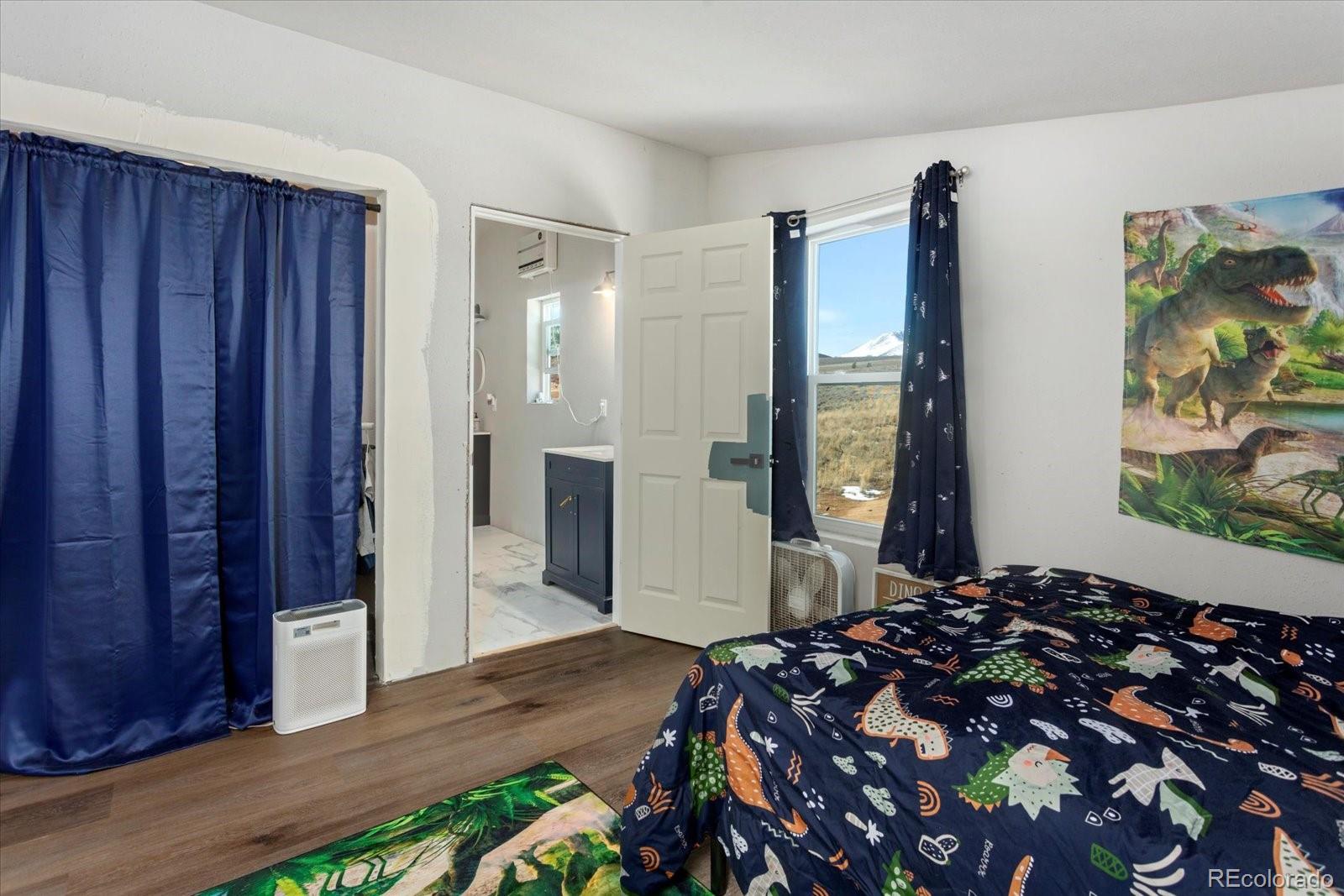51624 Co Road Villa Grove, CO 81155 - Photo 27 of 50 a bedroom with a bed and a dresser