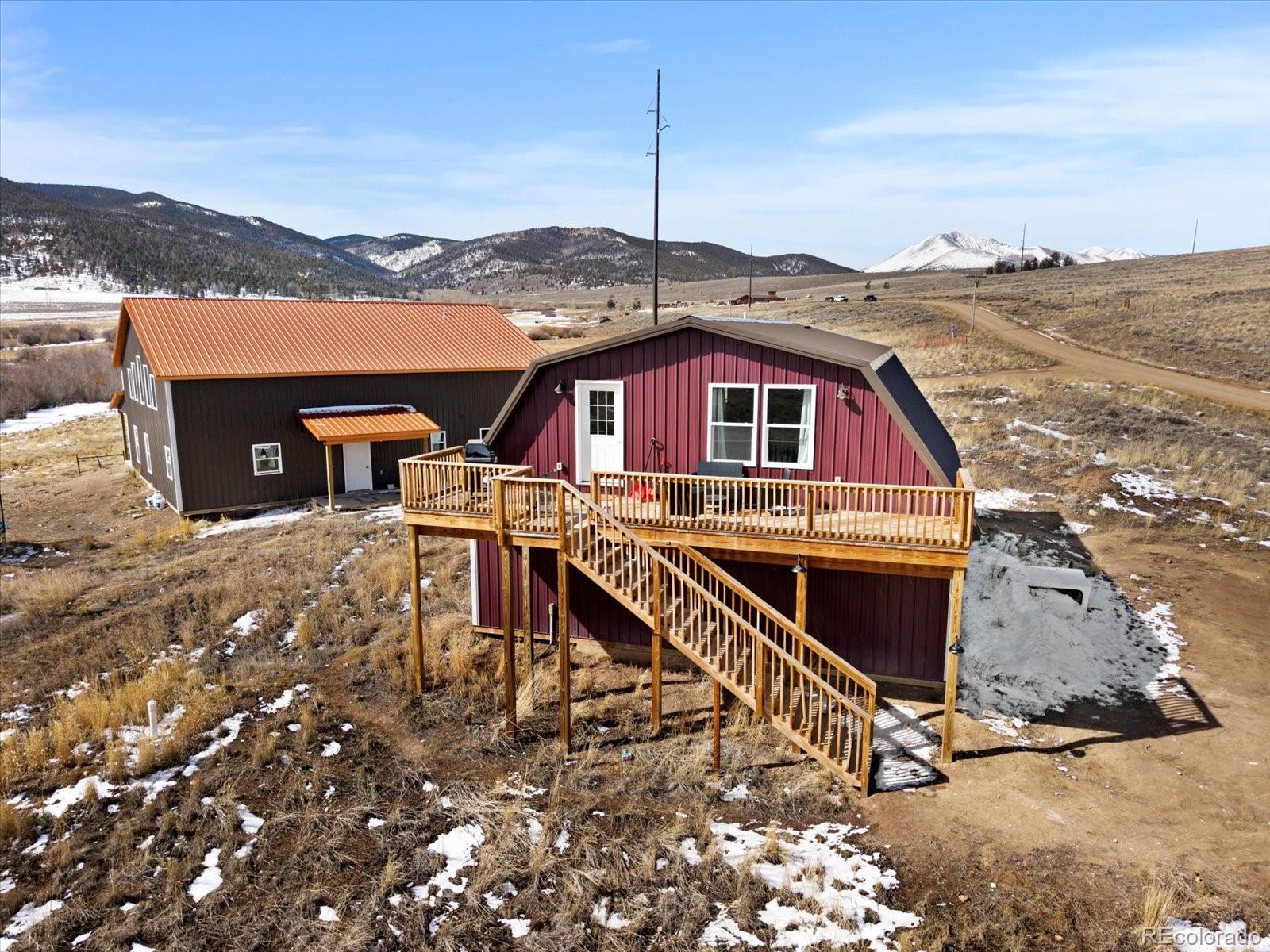 51624 Co Road Villa Grove, CO 81155 - Photo 37 of 50 a view of a roof deck with two couches and a potted plants
