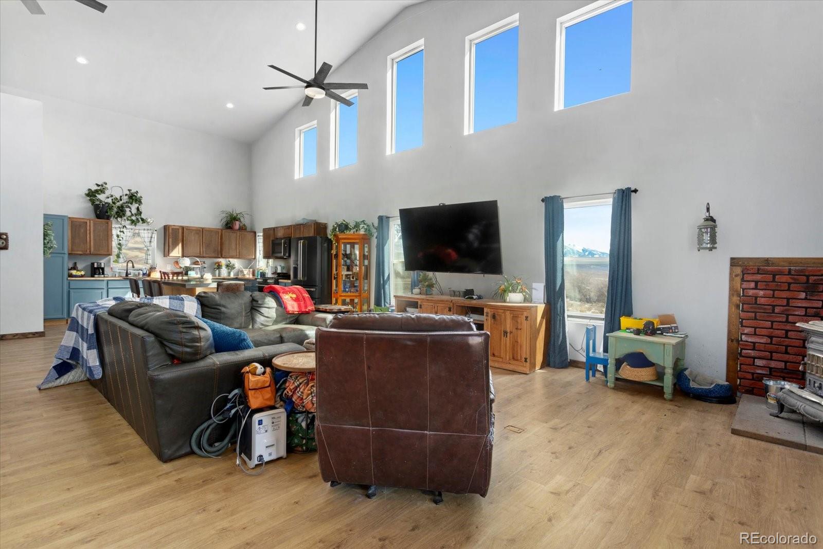 51624 Co Road Villa Grove, CO 81155 - Photo 5 of 50 a living room with furniture and a flat screen tv