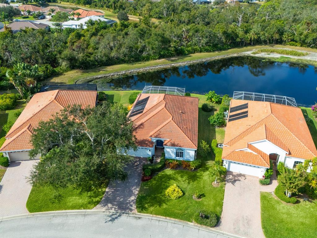an aerial view of house with yard swimming pool and outdoor seating