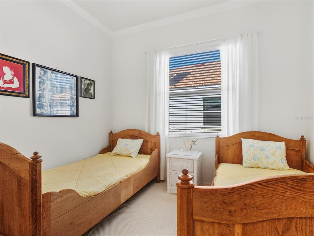 6524 Copper Ridge Trail University Park, FL 34201 - Photo 17 of 29 a bedroom with a bed and window