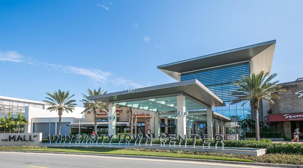 6524 Copper Ridge Trail University Park, FL 34201 - Photo 28 of 29 front view of a building with a yard