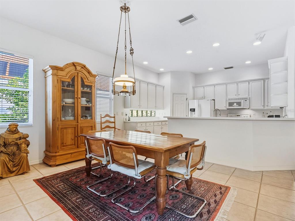 6524 Copper Ridge Trail University Park, FL 34201 - Photo 9 of 29 a living room with kitchen island furniture and a wooden floor