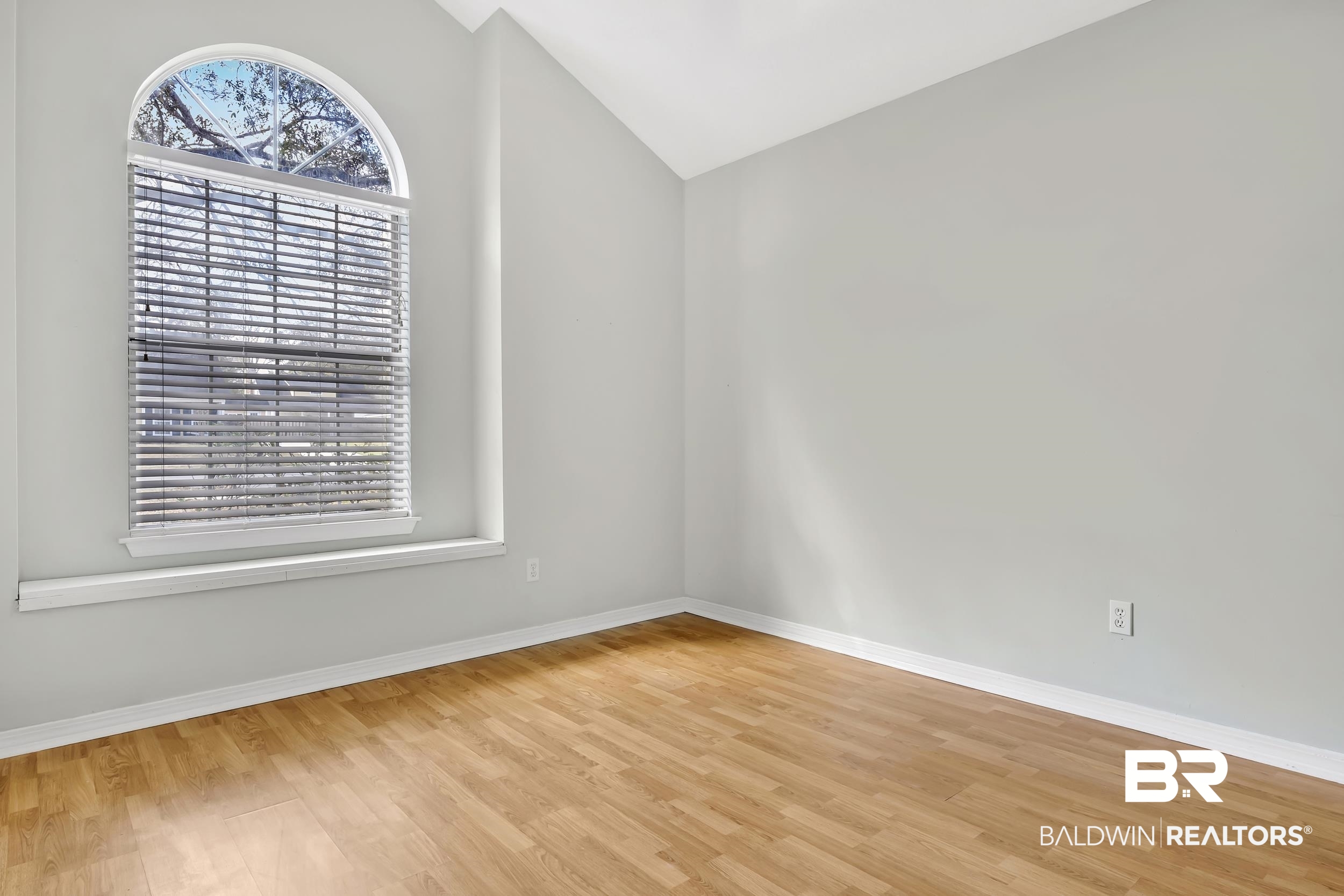 6616 Conde Court Mobile, AL 36695 - Photo 22 of 27 Unfurnished room with vaulted ceiling, baseboards, and light wood finished floors