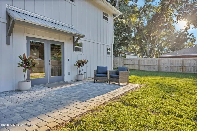 a view of a chairs and table in patio