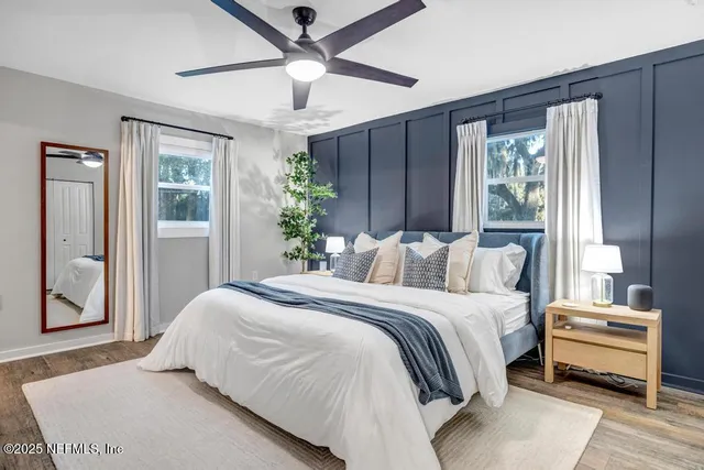 a bed room with a bed and a chandelier