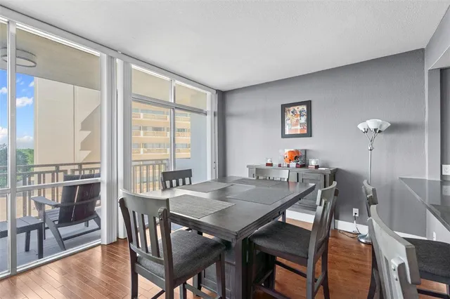 a view of a dining room with furniture and wooden floor
