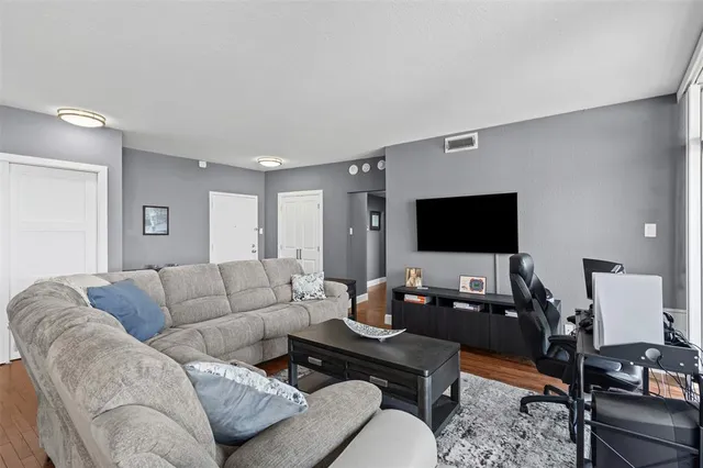 a open kitchen with stainless steel appliances granite countertop a sink and chairs