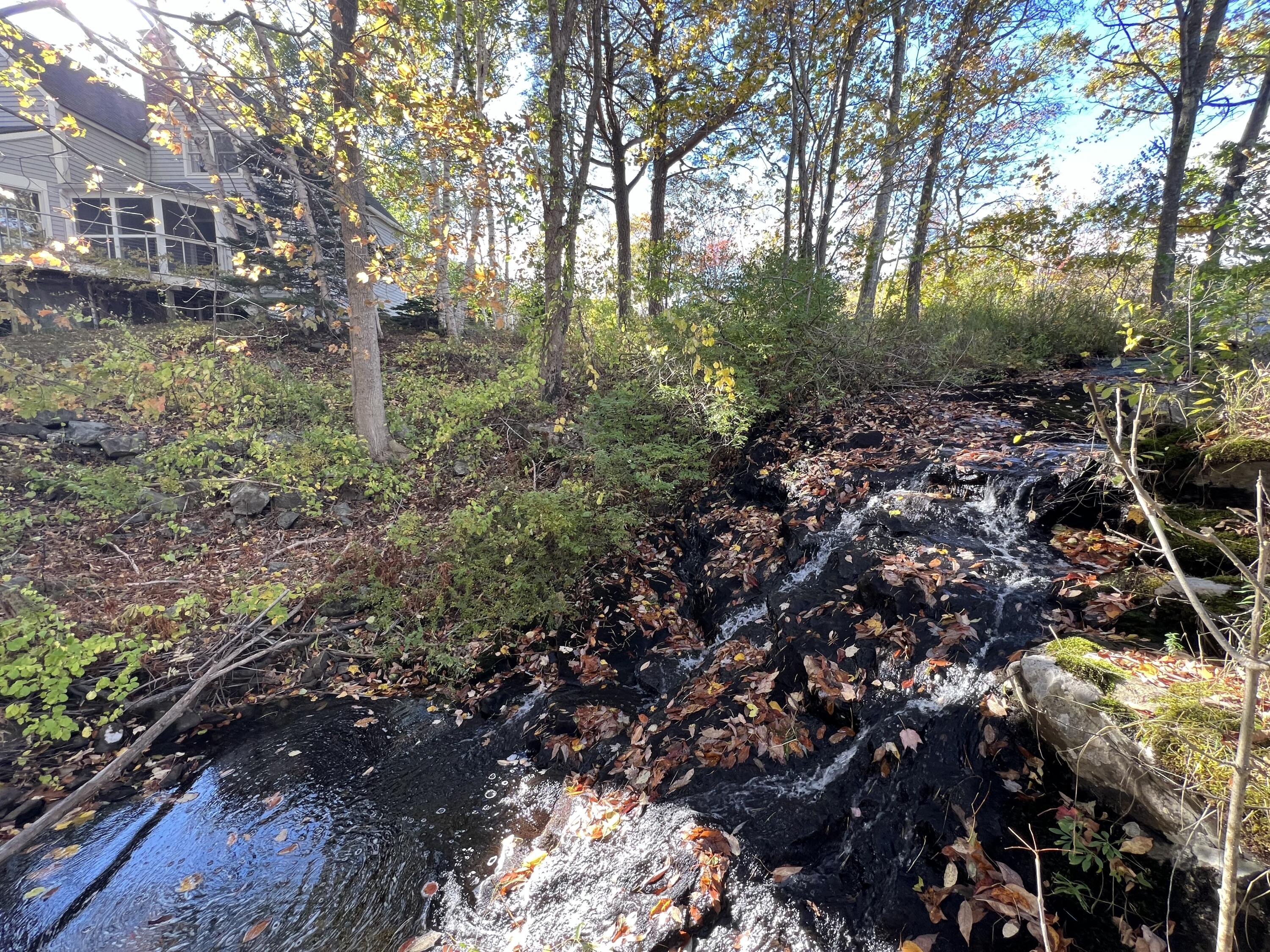 472 Schooner Head Road Bar Harbor, ME 04609 - Photo 13 of 113 waterfall with house