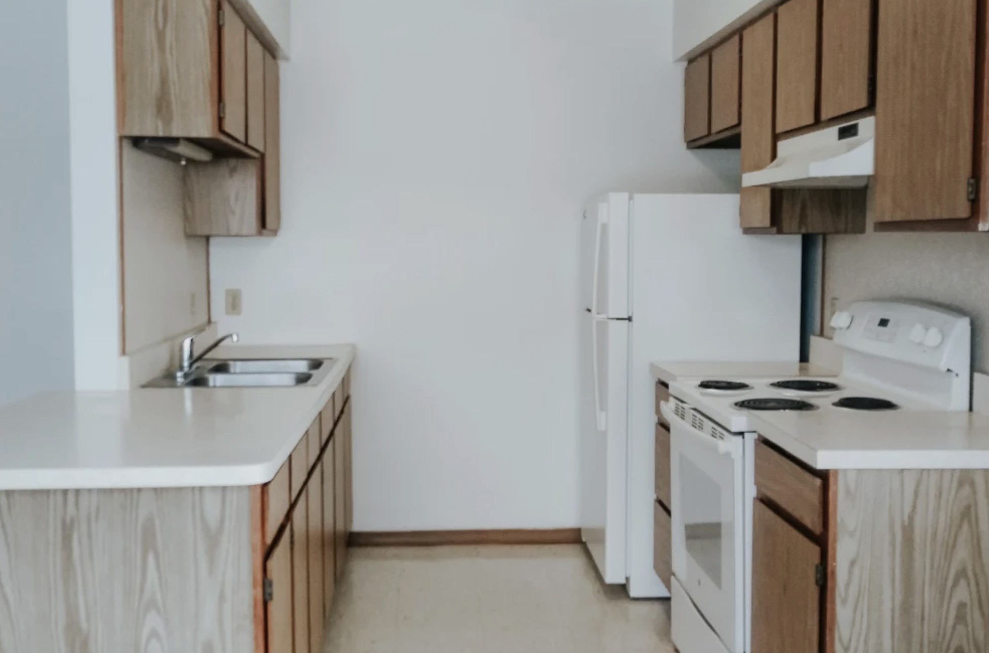 233 High Street Butler, IN 46721 - Photo 12 of 16 a kitchen with a stove and a sink