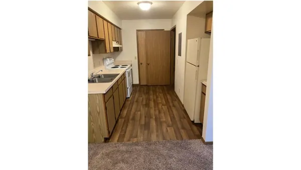a kitchen with a sink and a stove