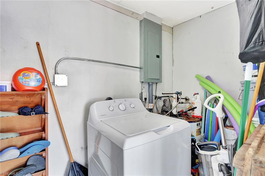 1009 Ridge Street Naples, FL 34103 - Photo 29 of 30 Laundry area featuring washer / dryer and electric panel