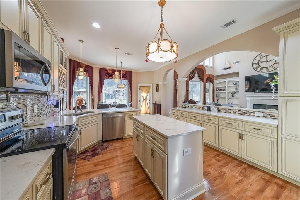 2425 Wild Oak Court Stockbridge, GA 30281 - Photo 19 of 39 a large kitchen with a large island in it