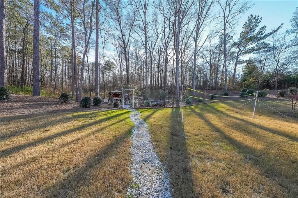 2425 Wild Oak Court Stockbridge, GA 30281 - Photo 28 of 32 a view of swimming pool with large trees