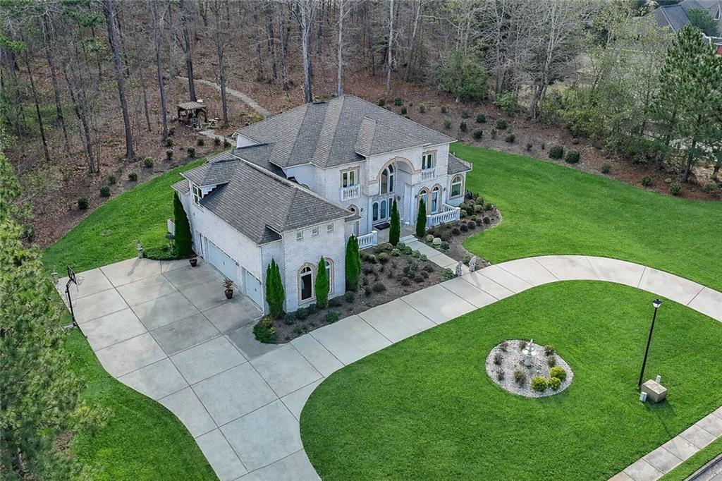 2425 Wild Oak Court Stockbridge, GA 30281 - Photo 3 of 32 an aerial view of a house with a garden