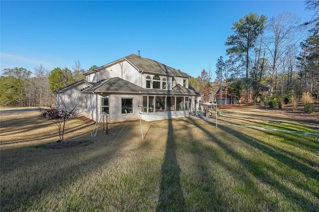 2425 Wild Oak Court Stockbridge, GA 30281 - Photo 31 of 32 a view of a house with a yard