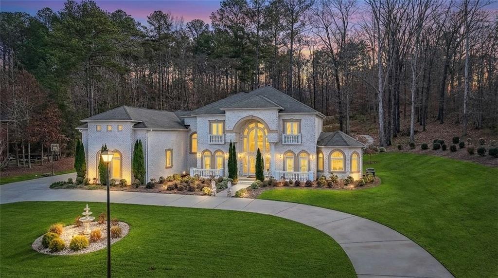 2425 Wild Oak Court Stockbridge, GA 30281 - Photo 5 of 39 a front view of a house with garden