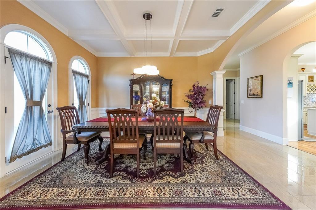 2425 Wild Oak Court Stockbridge, GA 30281 - Photo 10 of 32 a view of a dining room with furniture window and wooden floor