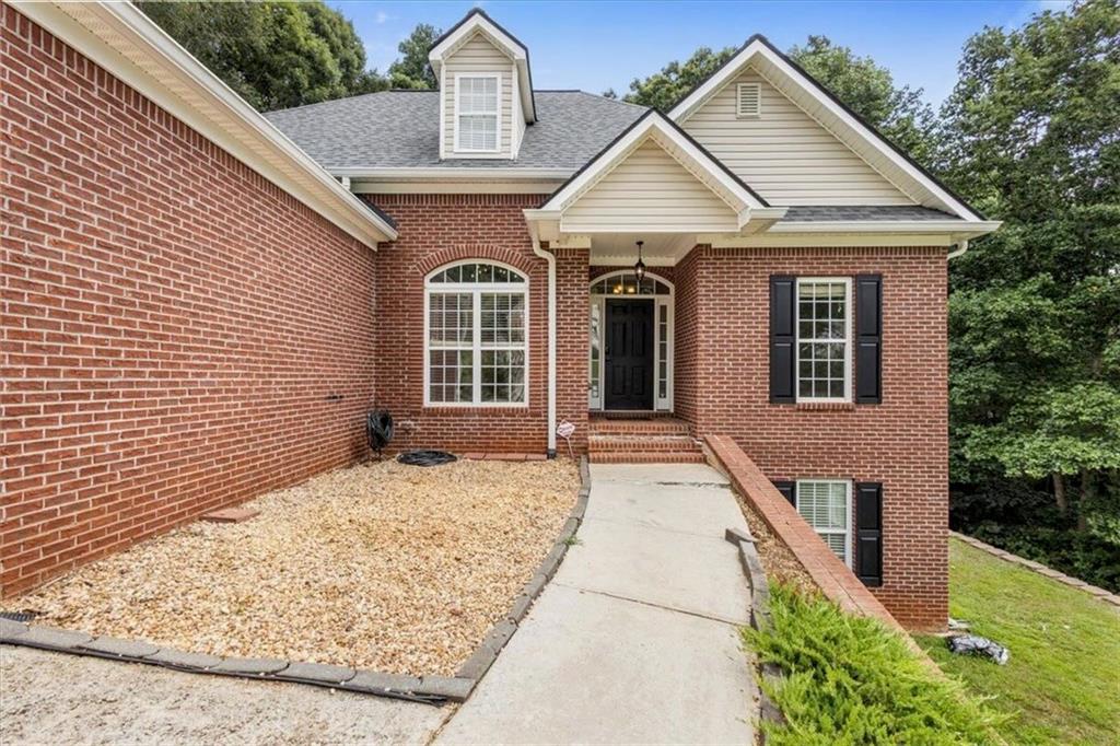 160 Amidon Drive Villa Rica, GA 30180 - Photo 2 of 39 a front view of a house with glass windows