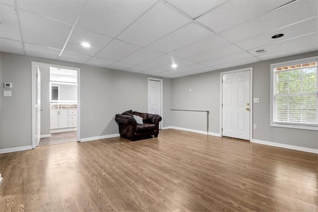 160 Amidon Drive Villa Rica, GA 30180 - Photo 25 of 39 a view of an empty room with wooden floor and a window