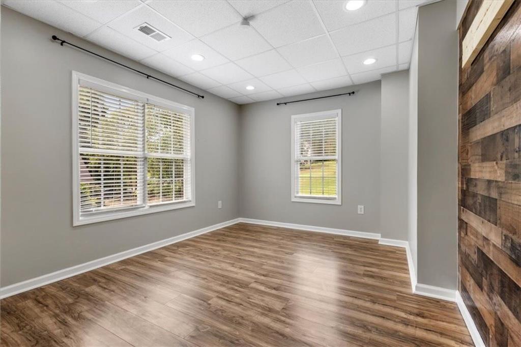 160 Amidon Drive Villa Rica, GA 30180 - Photo 27 of 39 a view of an empty room with wooden floor and a window
