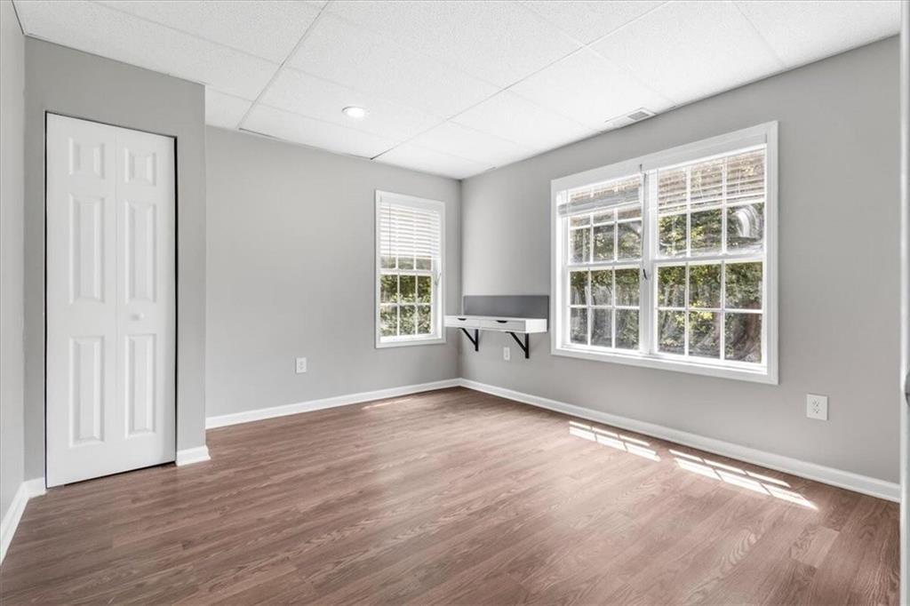 160 Amidon Drive Villa Rica, GA 30180 - Photo 29 of 39 an empty room with wooden floor and windows
