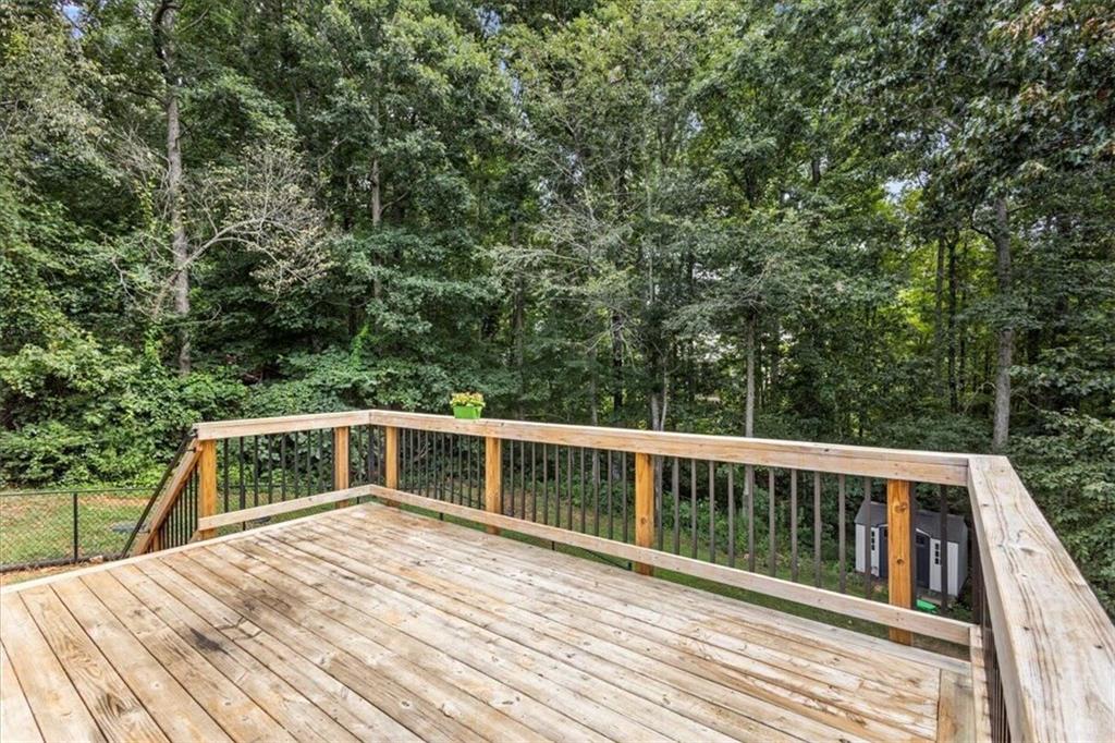 160 Amidon Drive Villa Rica, GA 30180 - Photo 32 of 39 a balcony with wooden floor and fence