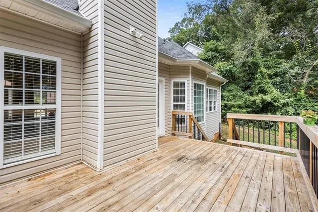a view of a wooden deck and a yard