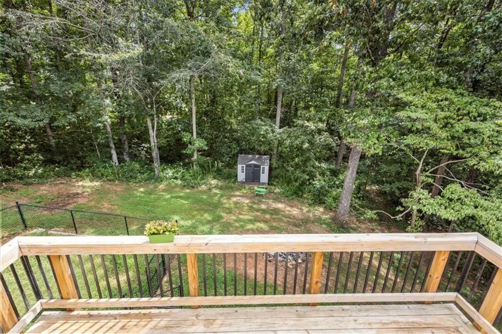 160 Amidon Drive Villa Rica, GA 30180 - Photo 34 of 39 a view of a wooden deck and a yard