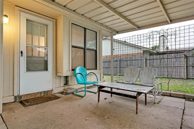 a reading room with furniture and a window