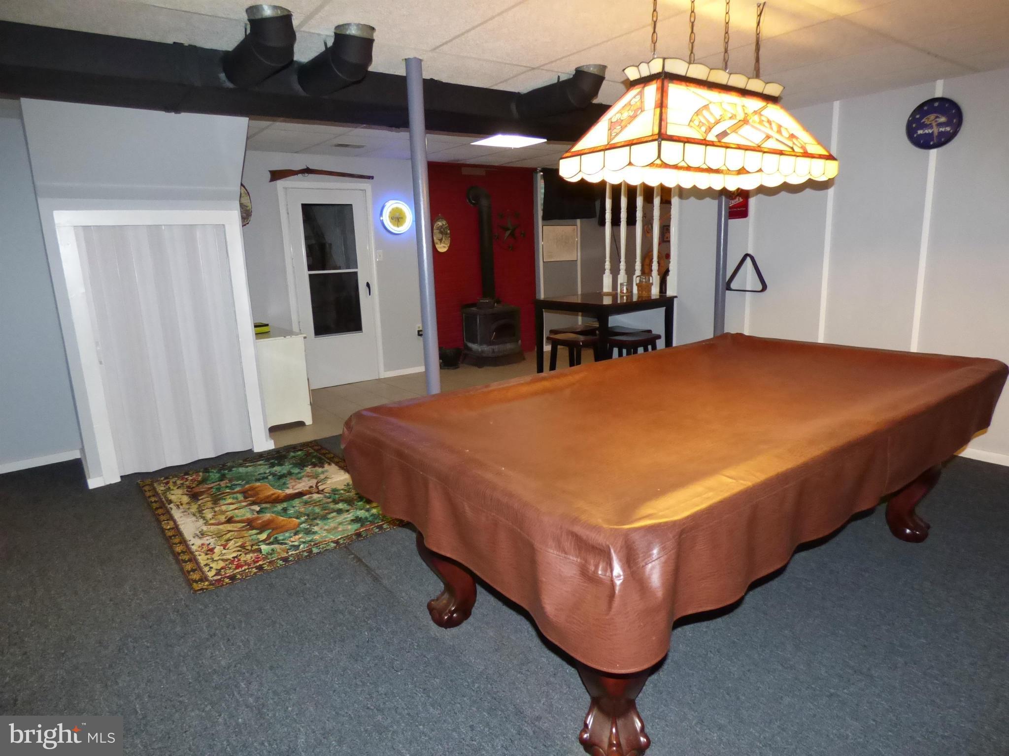 2011 Garrett Road Manchester, MD 21102 - Photo 13 of 23 Recreation Room with woodstove