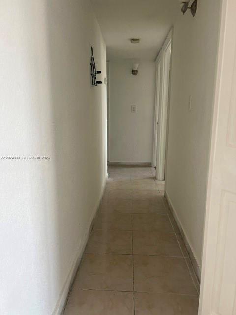 666 West 81st Street, Unit 103 Hialeah, FL 33014 - Photo 4 of 12 a view of a hallway