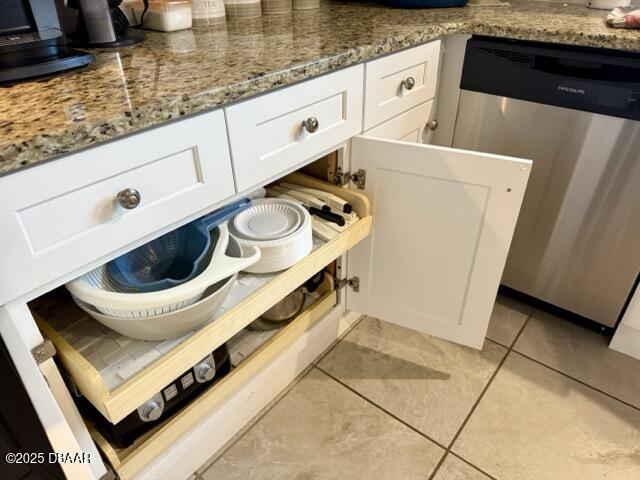 404 South Beach Street, Unit 101 Daytona Beach, FL 32114 - Photo 13 of 35 a kitchen with a stove and white cabinets