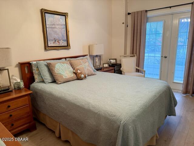 404 South Beach Street, Unit 101 Daytona Beach, FL 32114 - Photo 16 of 35 a bedroom with a bed and a mirror