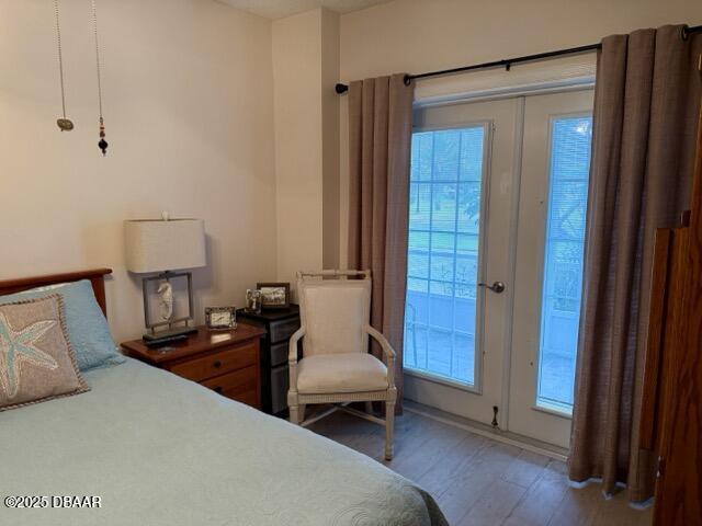 404 South Beach Street, Unit 101 Daytona Beach, FL 32114 - Photo 17 of 35 a bedroom with a bed and a mirror
