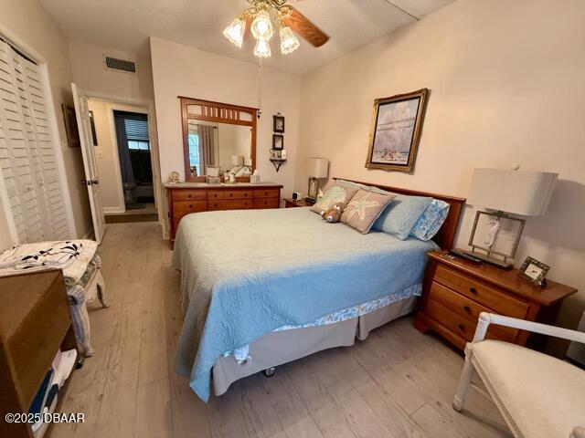 404 South Beach Street, Unit 101 Daytona Beach, FL 32114 - Photo 18 of 35 a bedroom with a bed and a mirror on dresser