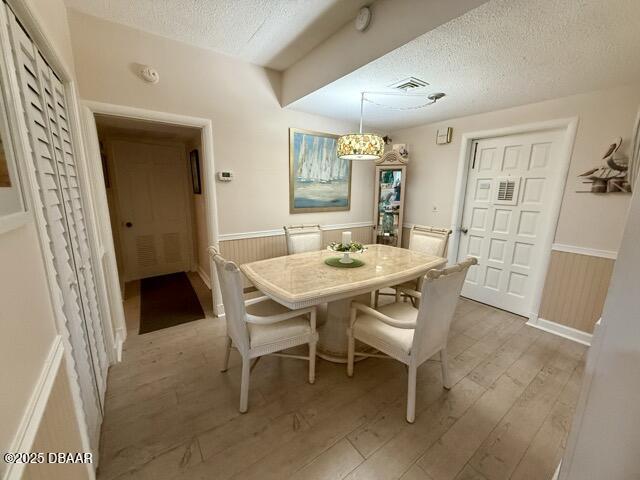 404 South Beach Street, Unit 101 Daytona Beach, FL 32114 - Photo 2 of 35 a dining room with furniture and window
