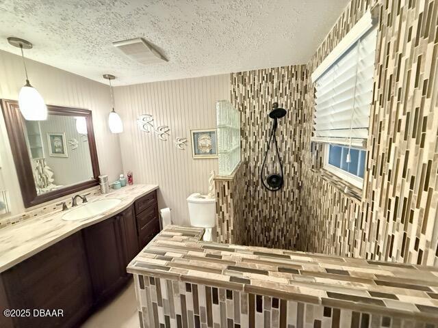 404 South Beach Street, Unit 101 Daytona Beach, FL 32114 - Photo 25 of 35 a bathroom with a sink a mirror and a shower