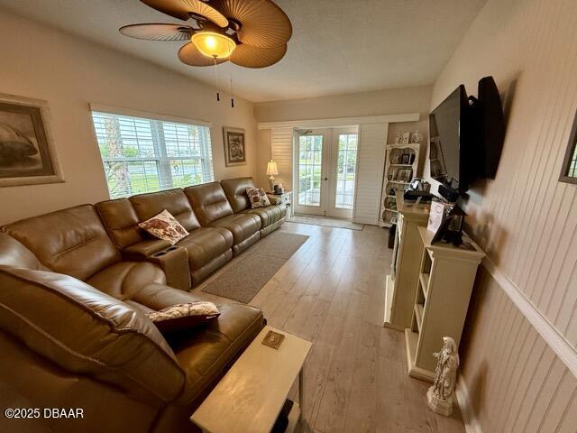 404 South Beach Street, Unit 101 Daytona Beach, FL 32114 - Photo 3 of 35 a living room with furniture a flat screen tv and a window