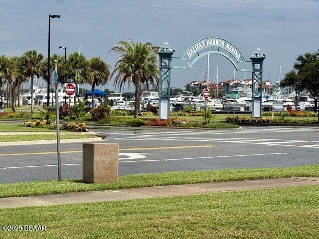 404 South Beach Street, Unit 101 Daytona Beach, FL 32114 - Photo 33 of 35 a view of a swimming pool with a house and a yard