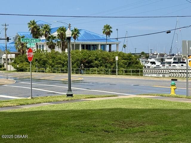 404 South Beach Street, Unit 101 Daytona Beach, FL 32114 - Photo 34 of 35 a view of a house with a yard