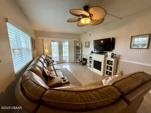 404 South Beach Street, Unit 101 Daytona Beach, FL 32114 - Photo 4 of 35 a living room with furniture and a flat screen tv
