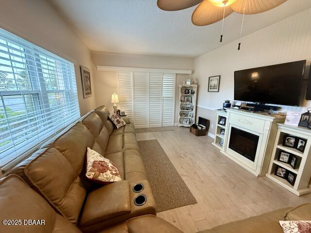 404 South Beach Street, Unit 101 Daytona Beach, FL 32114 - Photo 5 of 35 a living room with furniture and a flat screen tv