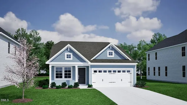 a view of house with yard and green space