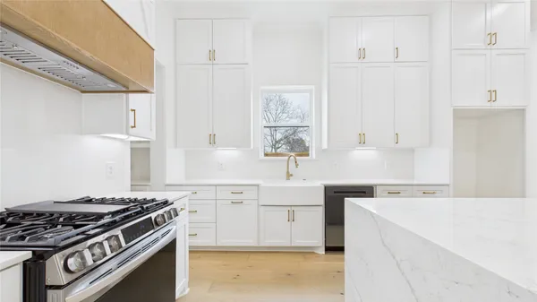 a kitchen with a sink and cabinets