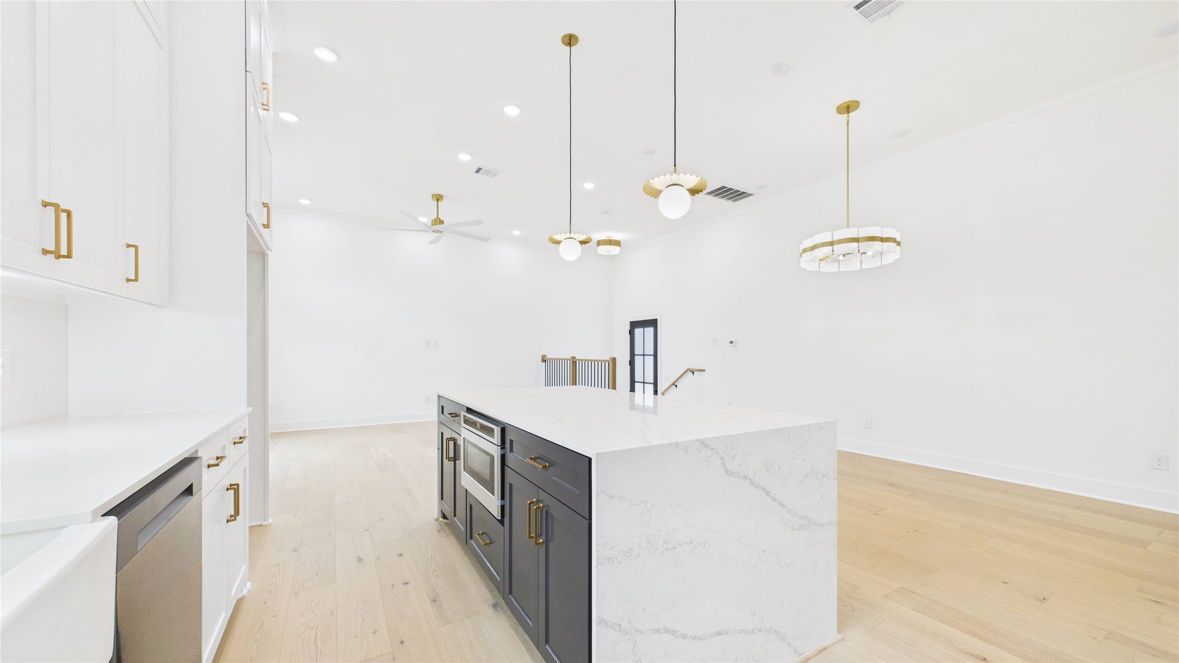602 Jewett Street, Unit A Houston, TX 77009 - Photo 10 of 46 Sleek pendant lighting. High ceilings and waterfall quartz countered island enhance the spacious feel.