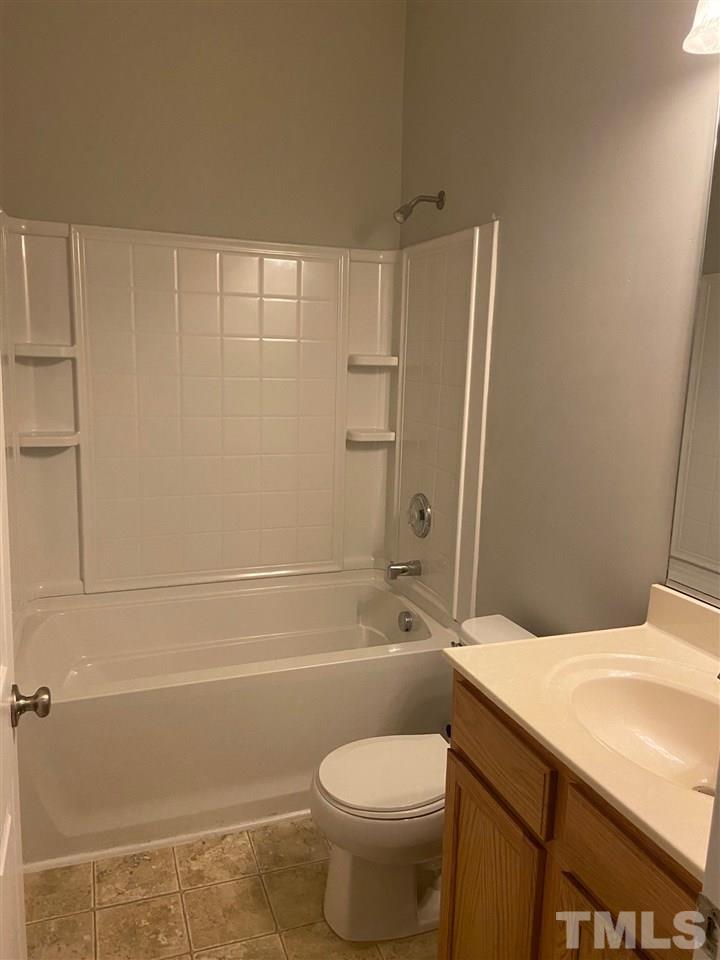 3048 Settle In Lane Raleigh, NC 27614 - Photo 5 of 5 a bathroom with a toilet and a shower